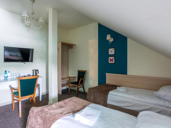 Dworek Jabłonna : photo 1 de la chambre chambre triple classique