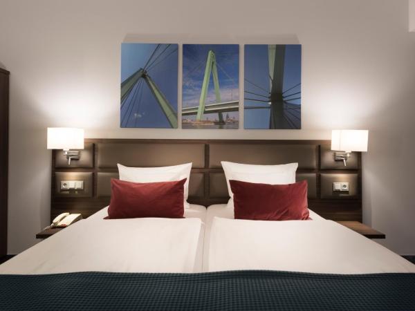 Wyndham Köln : photo 7 de la chambre chambre double ou lits jumeaux deluxe - vue sur ville 