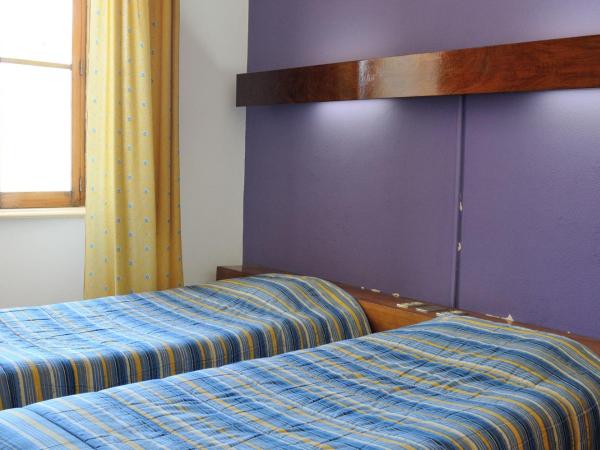 Residencial Moderna : photo 1 de la chambre chambre lits jumeaux