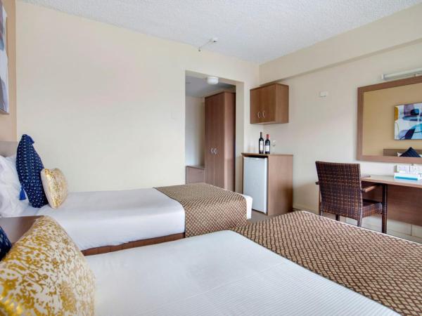 The Metropolitan Spring Hill : photo 3 de la chambre hébergement lits jumeaux metro