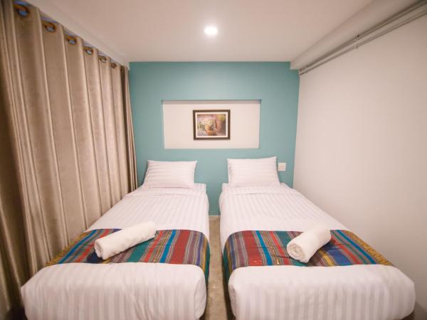 Suree House : photo 7 de la chambre chambre lits jumeaux avec salle de bains privative