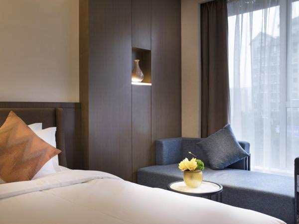 Paco Hotel Dongpu Guanghzou -Free Shuttle Bus for Canton Fair : photo 4 de la chambre chambre lits jumeaux deluxe