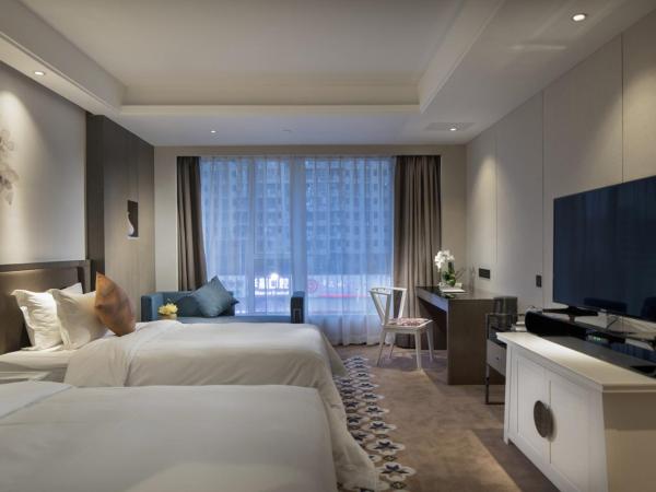 Paco Hotel Dongpu Guanghzou -Free Shuttle Bus for Canton Fair : photo 2 de la chambre chambre lits jumeaux deluxe