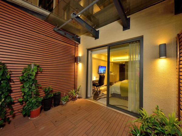 HaiJun Hotel -Free Canton Fair Shuttle Bus : photo 2 de la chambre chambre double - vue sur jardin