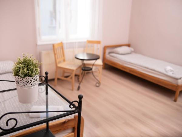 Hostel Krakowskie Klimaty : photo 4 de la chambre chambre quadruple