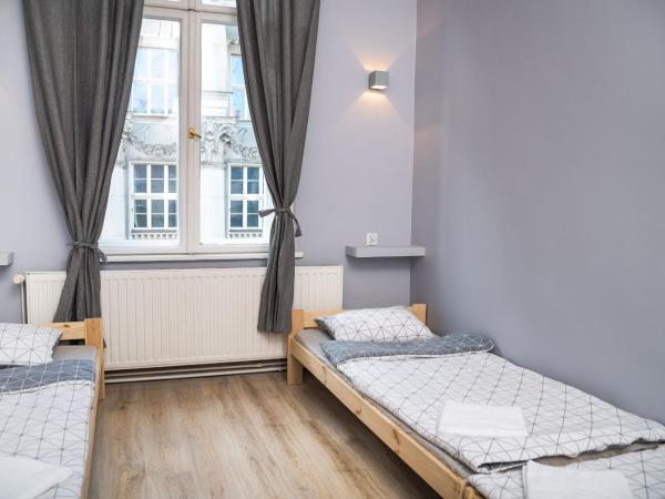 Hostel Krakowskie Klimaty : photo 7 de la chambre chambre quadruple