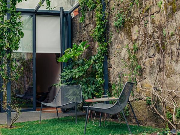 Rosa Et Al Townhouse : photo 2 de la chambre chambre double ou lits jumeaux deluxe – vue sur jardin