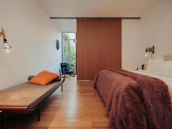 Rosa Et Al Townhouse : photo 10 de la chambre chambre double ou lits jumeaux deluxe – vue sur jardin