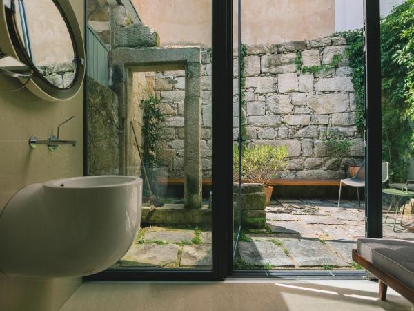 Rosa Et Al Townhouse : photo 7 de la chambre chambre double ou lits jumeaux deluxe – vue sur jardin