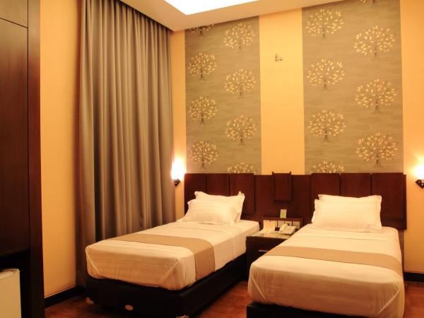 Omah Qu Guesthouse Malioboro : photo 1 de la chambre chambre lits jumeaux deluxe