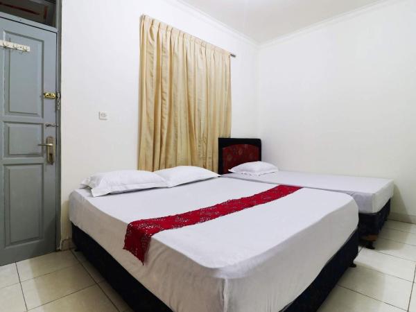 Wisma Lamida 2 Syariah : photo 1 de la chambre chambre familiale