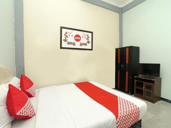 Kartika Syariah Homestay by Stayku : photo 5 de la chambre chambre double standard