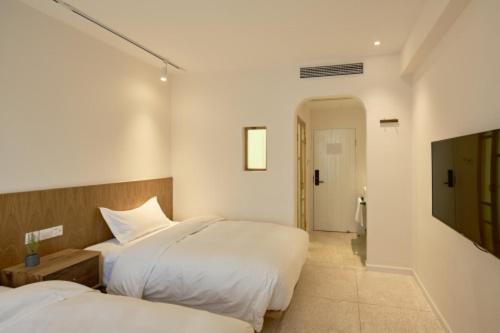 Wei Wen Inn : photo 5 de la chambre chambre double ou lits jumeaux standard - vue sur jardin