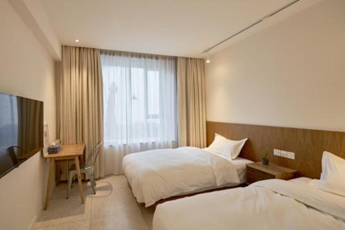 Wei Wen Inn : photo 6 de la chambre chambre double ou lits jumeaux standard - vue sur jardin