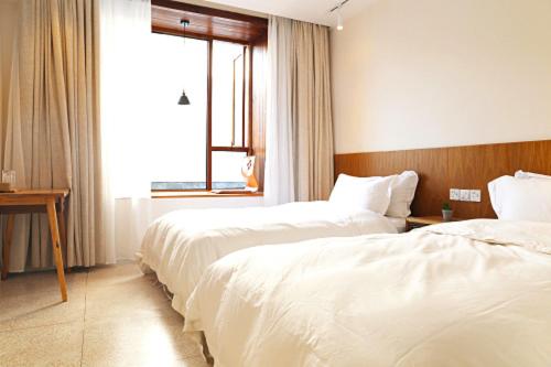 Wei Wen Inn : photo 9 de la chambre chambre double ou lits jumeaux standard - vue sur jardin