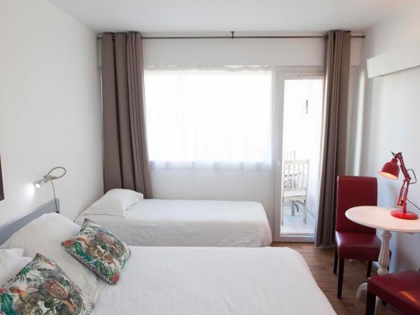 Motel Cap Sol : photo 4 de la chambre chambre triple confort (3 adultes) - vue sur jardin 