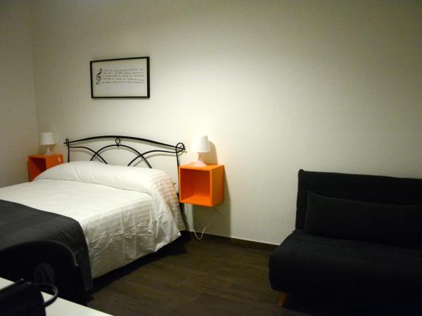 Mambo Suites : photo 6 de la chambre chambre double deluxe avec lit d'appoint