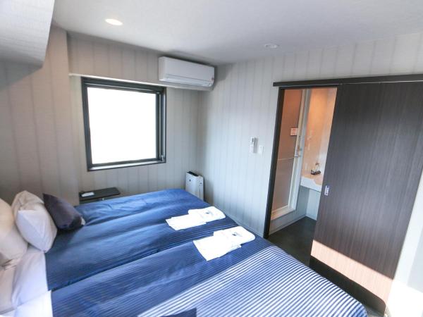 HOTEL LiVEMAX Sapporo Susukino : photo 6 de la chambre chambre lits jumeaux - fumeurs