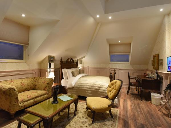 The Aston Tavern : photo 1 de la chambre suite deluxe avec lit king-size