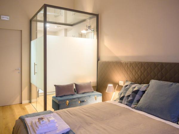 Savoia Suites Torino : photo 5 de la chambre chambre double ou lits jumeaux - vue sur jardin