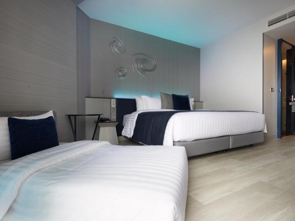 Grande Centre Point Pattaya : photo 2 de la chambre chambre double ou lits jumeaux supérieure avec canapé-lit