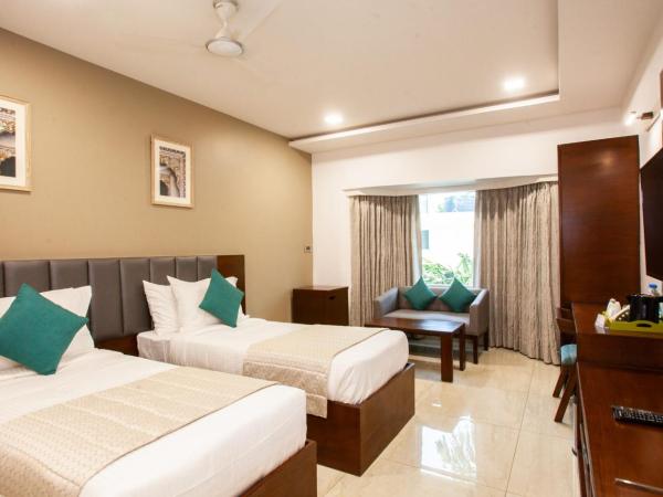 Mango Suites Viera : photo 3 de la chambre chambre double ou lits jumeaux