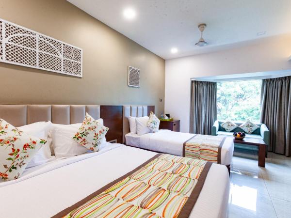 Mango Suites Viera : photo 7 de la chambre grande chambre double