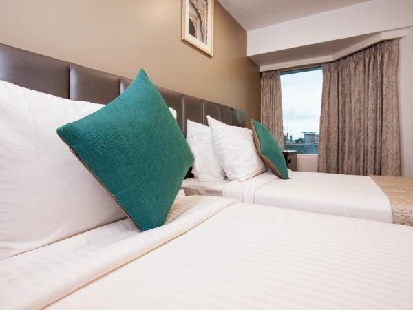 Mango Suites Viera : photo 2 de la chambre chambre deluxe double ou lits jumeaux