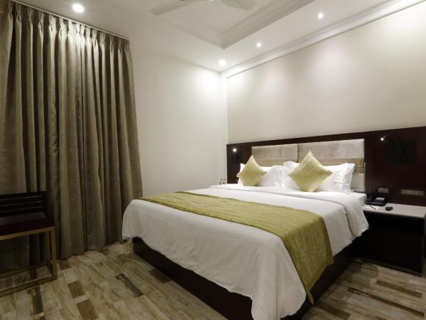 Regenta Inn Ranip Ahmedabad : photo 9 de la chambre chambre double ou lits jumeaux deluxe 