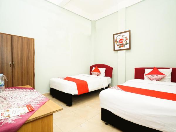Kartika Syariah Homestay by Stayku : photo 7 de la chambre chambre lits jumeaux standard