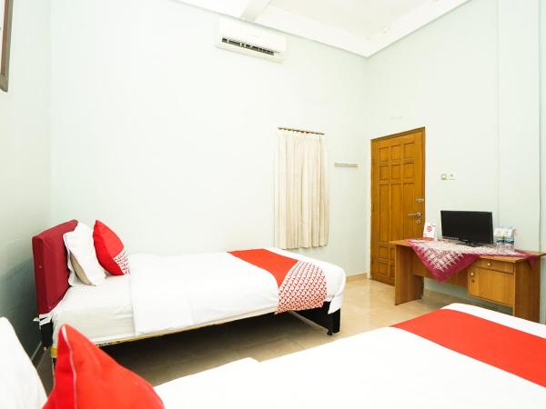 Kartika Syariah Homestay by Stayku : photo 5 de la chambre chambre lits jumeaux standard