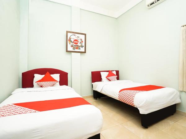 Kartika Syariah Homestay by Stayku : photo 1 de la chambre chambre lits jumeaux standard