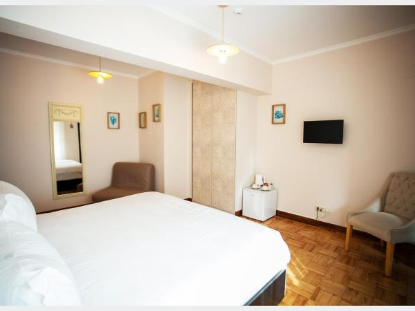 Senhor Gigi : photo 4 de la chambre chambre double ou lits jumeaux deluxe – vue sur jardin