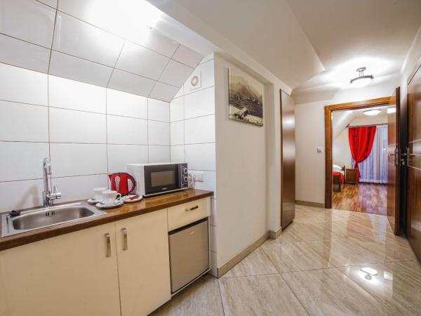 Grand Podhale Resort&Spa- Jacuzzi - Sauna fińska i Łaźnia parowa - Widok na Tatry : photo 10 de la chambre appartement avec vue sur la montagne