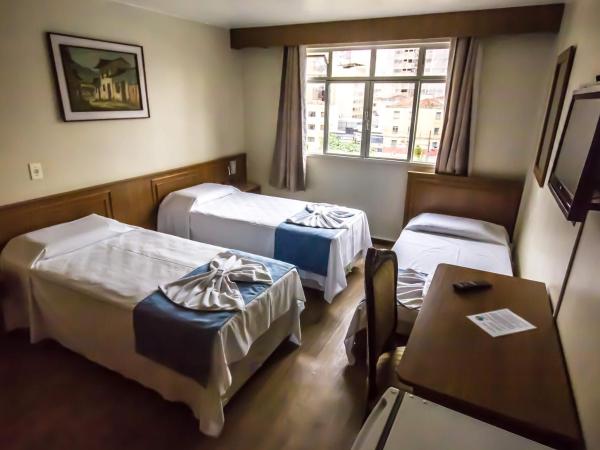 Estrela do Sul Hotel : photo 4 de la chambre chambre triple standard avec 3 lits simples