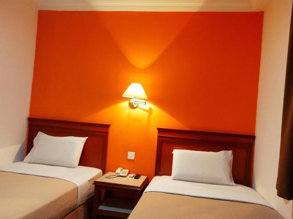 Megah Inn : photo 4 de la chambre chambre lits jumeaux standard