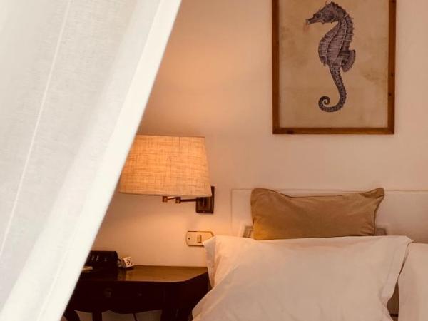 Marunnella Suites : photo 4 de la chambre  chambre double exécutive - vue sur jardin