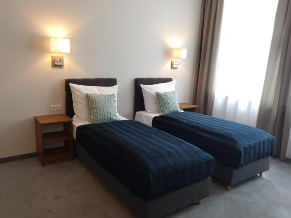 Brassel Aparthotel : photo 7 de la chambre chambre lits jumeaux