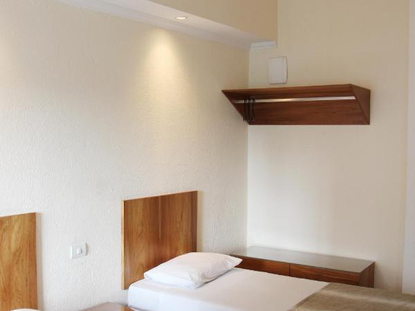Hotel Rojas All Suite : photo 7 de la chambre suite standard 4 lits simples
