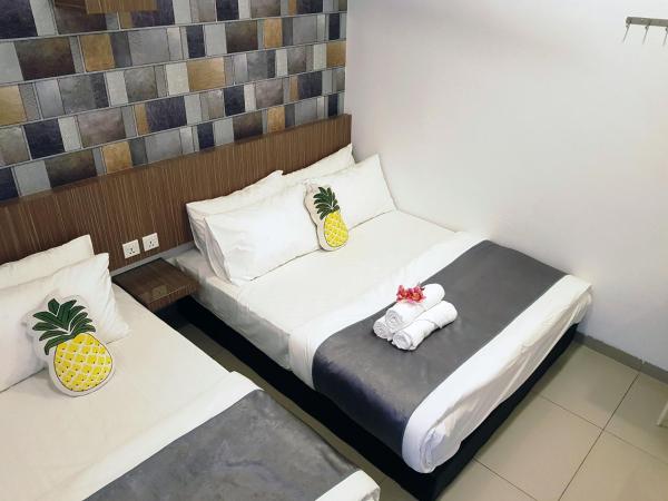 Teruntum 96 Guest house : photo 2 de la chambre chambre triple deluxe