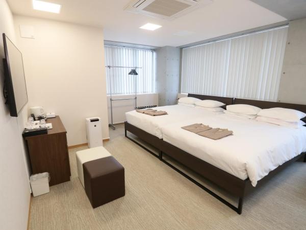 Business Capsule Hotel Lightning Hotel Asakusa : photo 1 de la chambre chambre familiale - vue sur ville