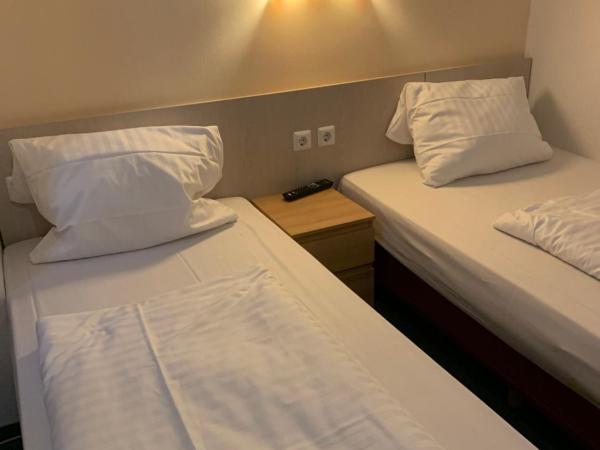 Hotel New Fair Munich Messe : photo 2 de la chambre chambre lits jumeaux