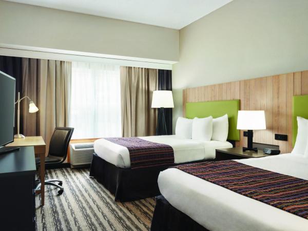 Country Inn & Suites by Radisson, Nashville Airport East, TN : photo 6 de la chambre suite avec 2 lits queen-size