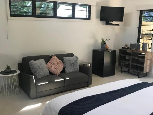 The Tropical Sanctuary : photo 3 de la chambre suite lit king-size - vue sur piscine