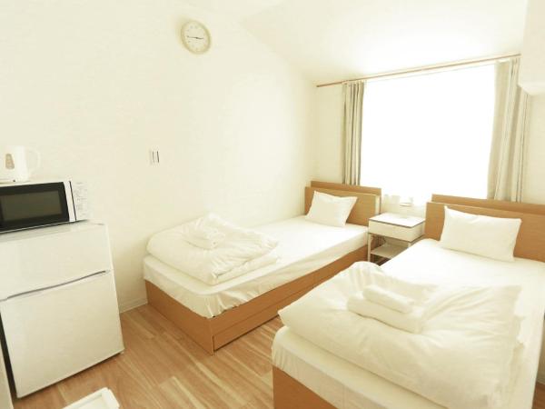 コインズホステル天神ペット宿泊可 : photo 1 de la chambre chambre lits jumeaux deluxe