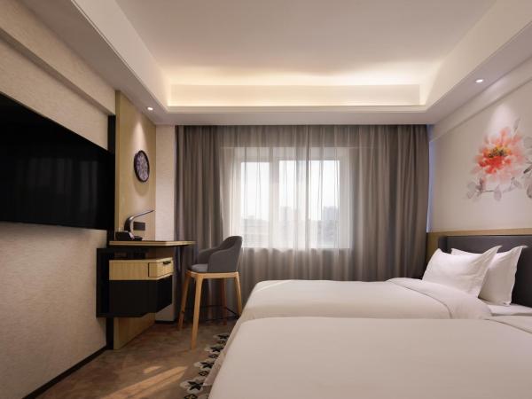Paco Hotel Jiangtai Lu Metro Guangzhou ---Free Shuttle Bus For CantonFair : photo 1 de la chambre chambre lits jumeaux deluxe