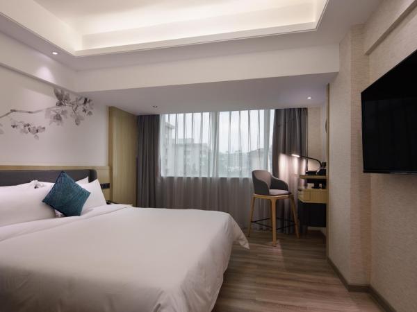 Paco Hotel Jiangtai Lu Metro Guangzhou ---Free Shuttle Bus For CantonFair : photo 1 de la chambre chambre lit queen-size deluxe