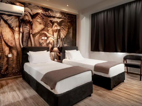 Pallada Athens boutique rooms & apartments : photo 3 de la chambre chambre double deluxe avec 2 lits jumeaux