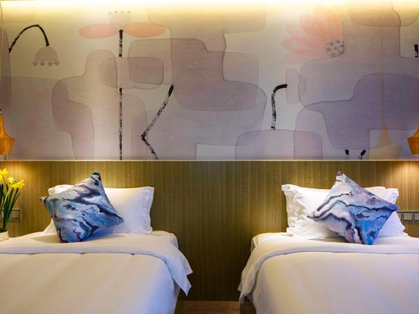 Paco Hotel Tianpingjia Metro Guangzhou - Canton Fair free shuttle bus : photo 7 de la chambre chambre lits jumeaux deluxe