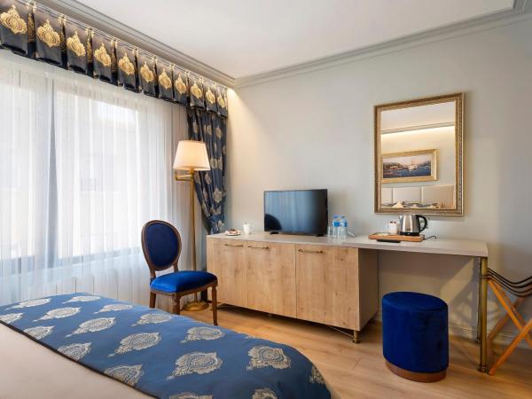 Güner Business Hotel : photo 3 de la chambre chambre double deluxe (2 adultes + 1 enfant)